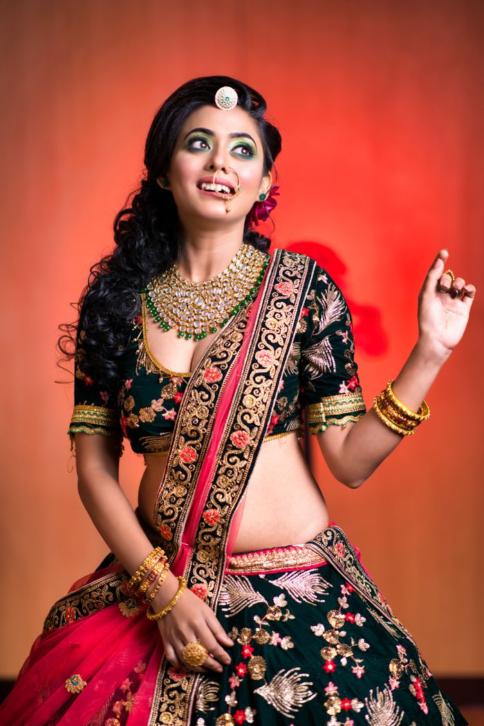 Mastering the First Impression: Your intriguing post title goes here Portrait of a young Indian woman in traditional saree with elegant jewelry, smiling.